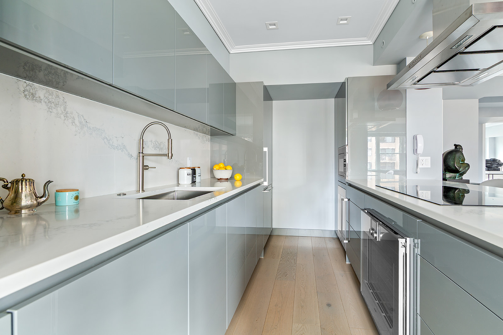 165 East 72nd Street, Unit 17L Manhattan, NY 10021 - Photo 4 of 12 a view of a kitchen with a sink and cabinets