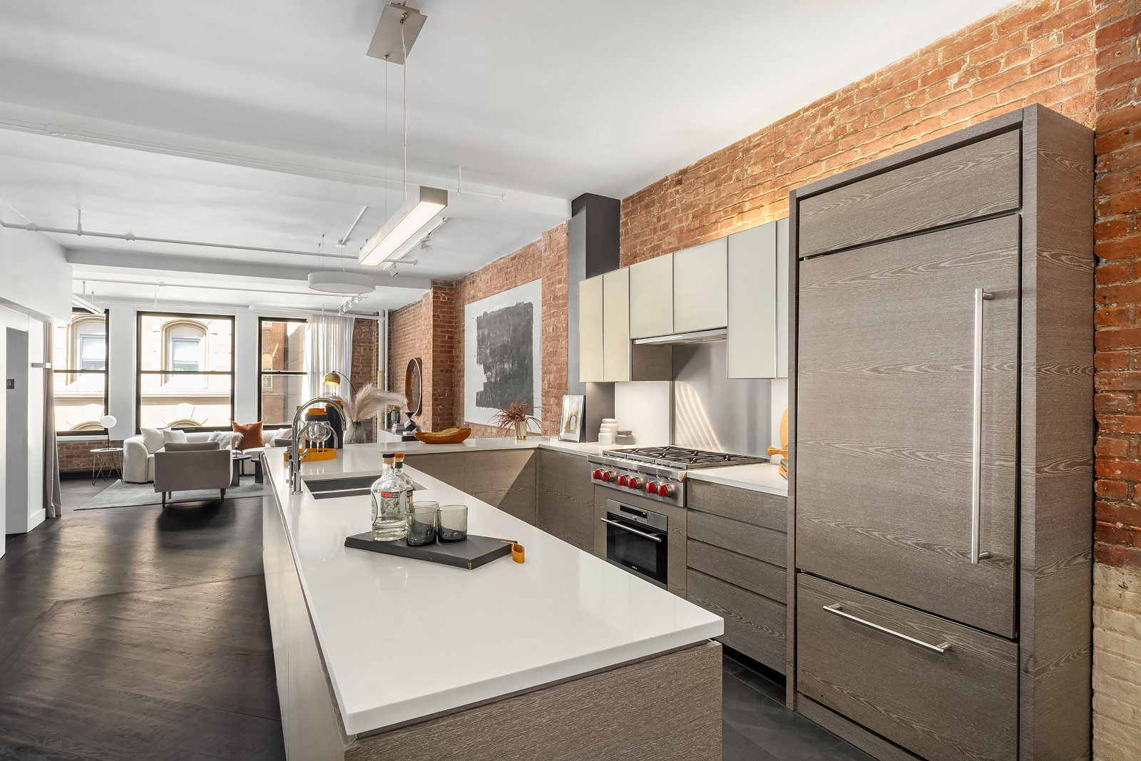 36 West 15th Street, Unit 4 Manhattan, NY 10011 - Photo 8 of 21 a kitchen with a refrigerator and white cabinets