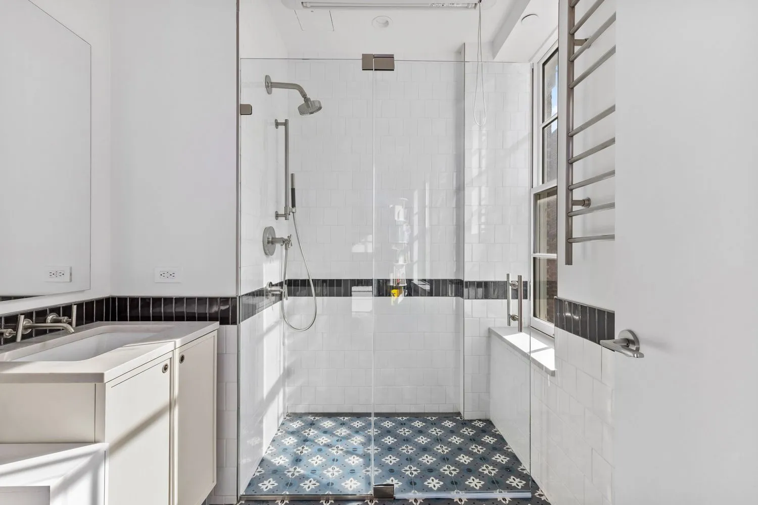 a bathroom with a sink and a shower
