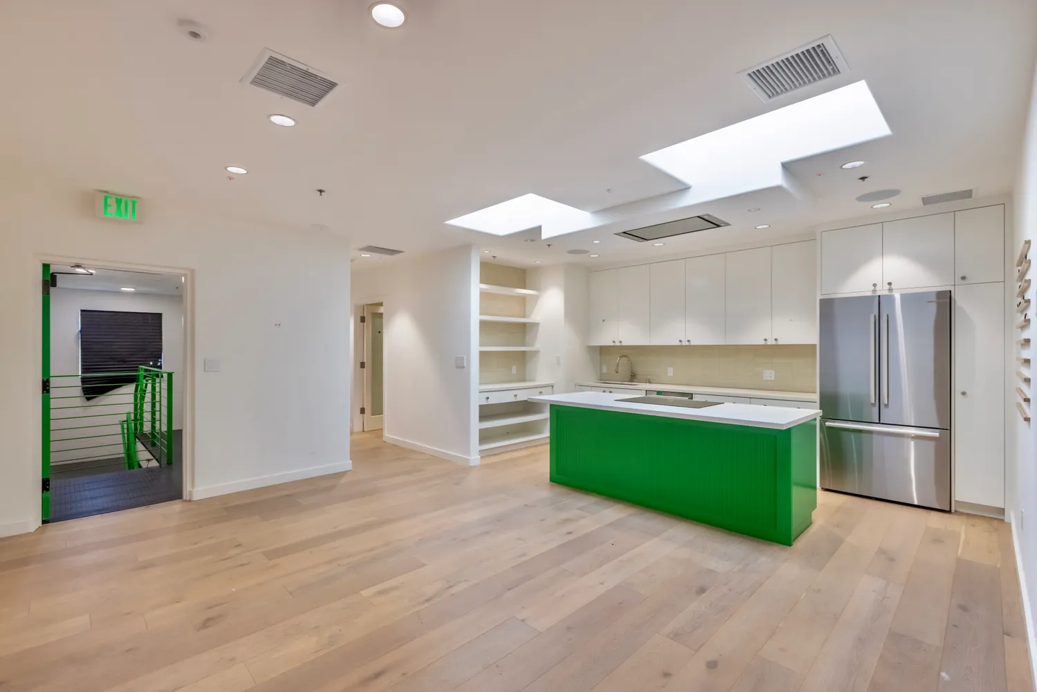 a kitchen with a cabinets and a wooden floor