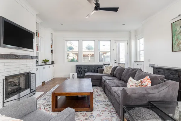 a living room with furniture and a fireplace