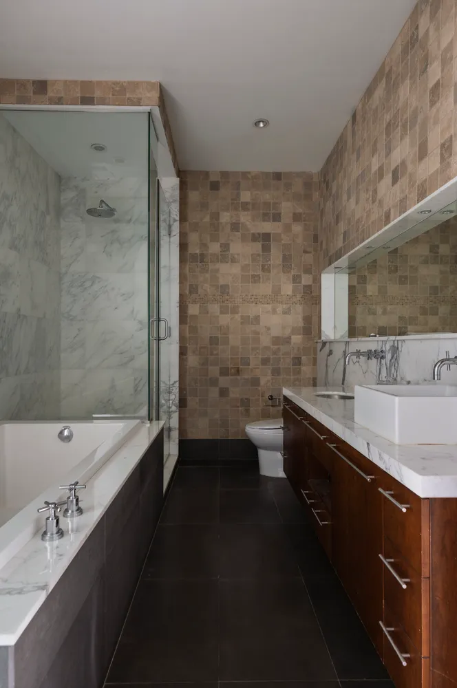a bathroom with a bathtub and a sink
