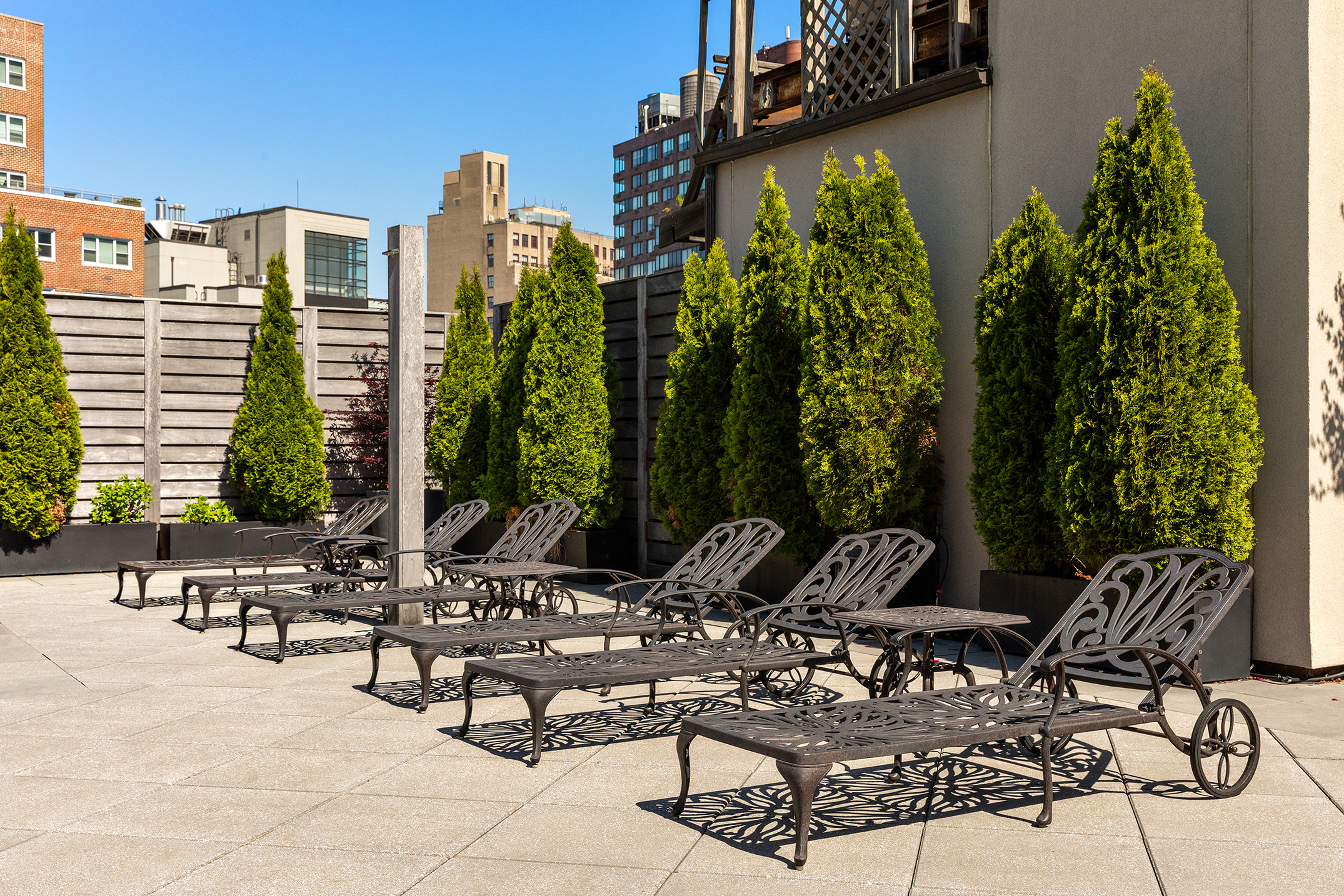 115 4th Avenue, Unit 2I Manhattan, NY 10003 - Photo 10 of 12 a view of a patio with table and chairs and potted plants