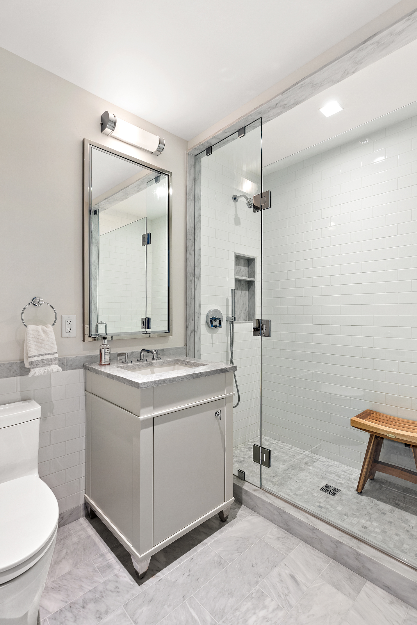 250 West 81st Street, Unit 8B Manhattan, NY 10024 - Photo 13 of 19 a bathroom with a sink a toilet and mirror