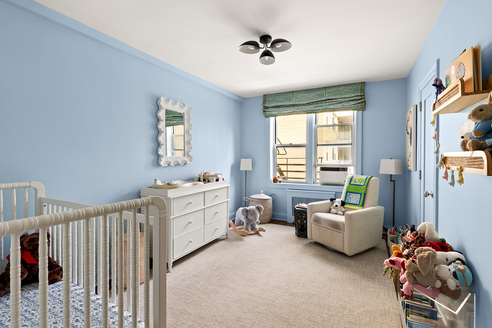 30 East 9th Street, Unit 5LL Manhattan, NY 10003 - Photo 7 of 10 a bed room with furniture and a window