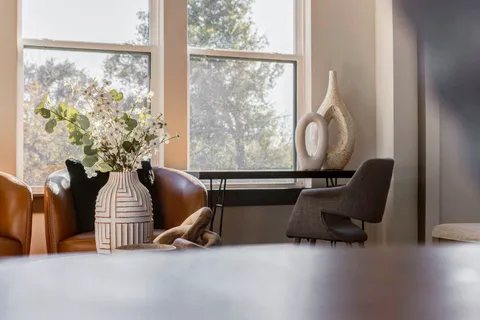 a living room with furniture and a large window