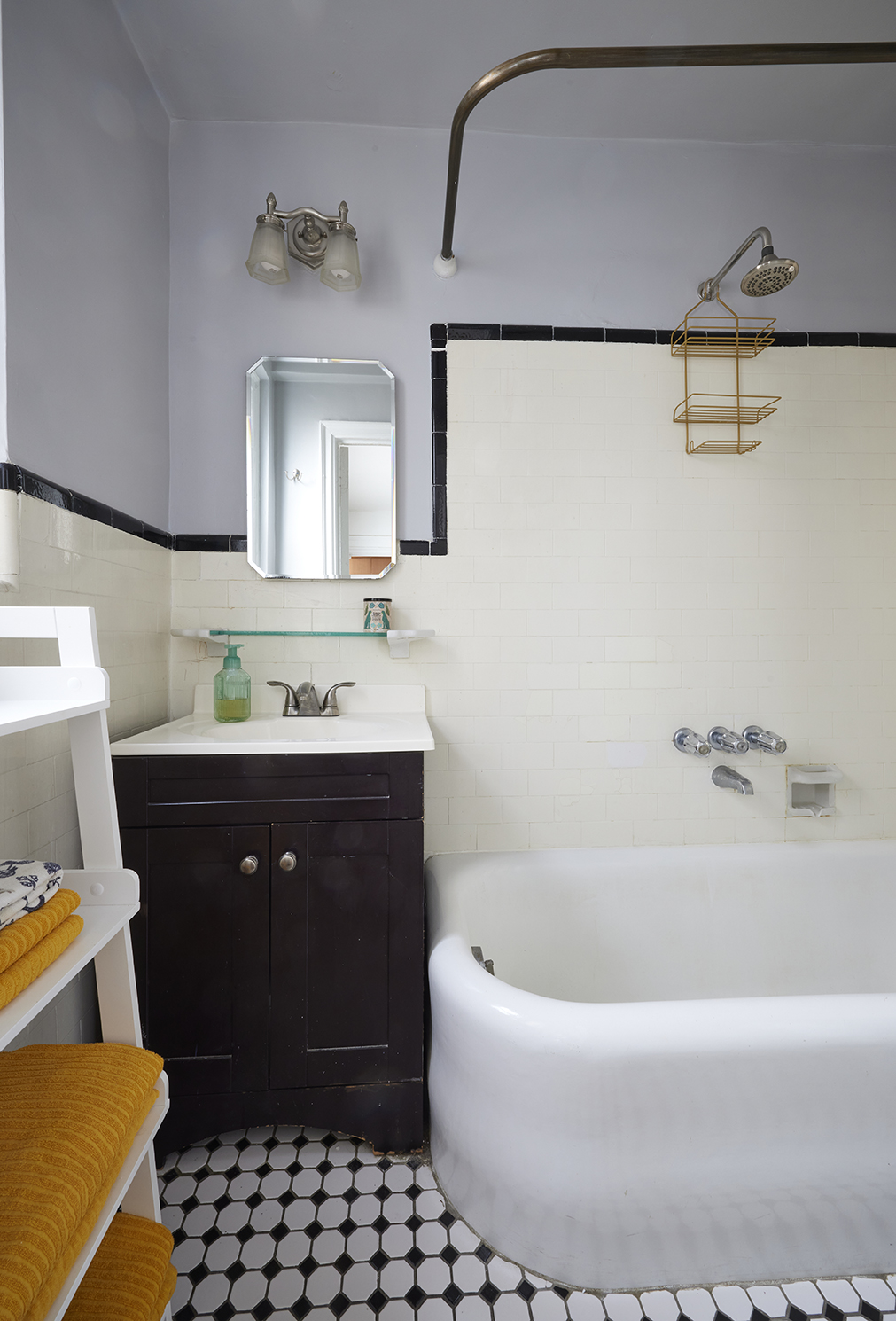 339 East 58th Street, Unit 9H Manhattan, NY 10022 - Photo 4 of 7 a bathroom with a bathtub sink and mirror
