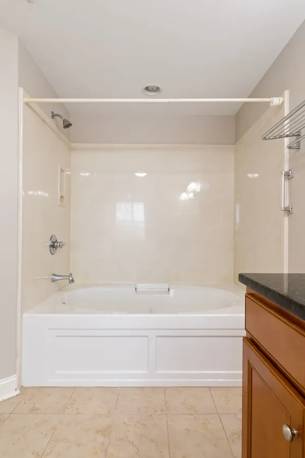 a bathroom with a bathtub and a shower