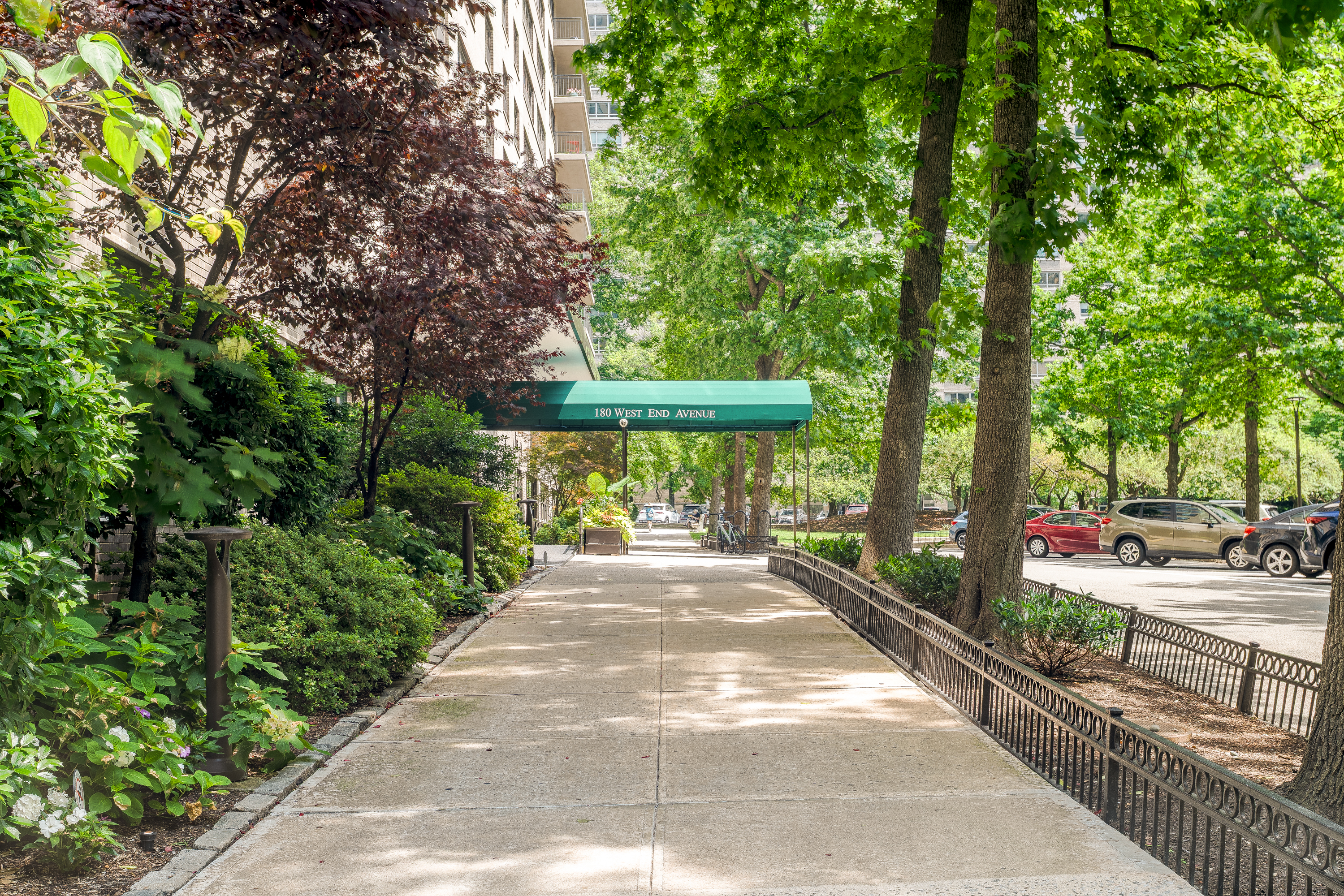 180 West End Avenue, Unit 5H Manhattan, NY 10023 - Photo 15 of 18 a view of a garden with large trees