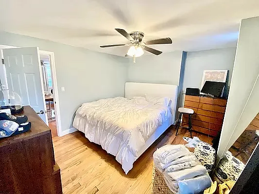 195 Atlantic Avenue, Unit 1 Brooklyn, NY 11201 - Photo 6 of 10 a bedroom with a bed and wooden floor
