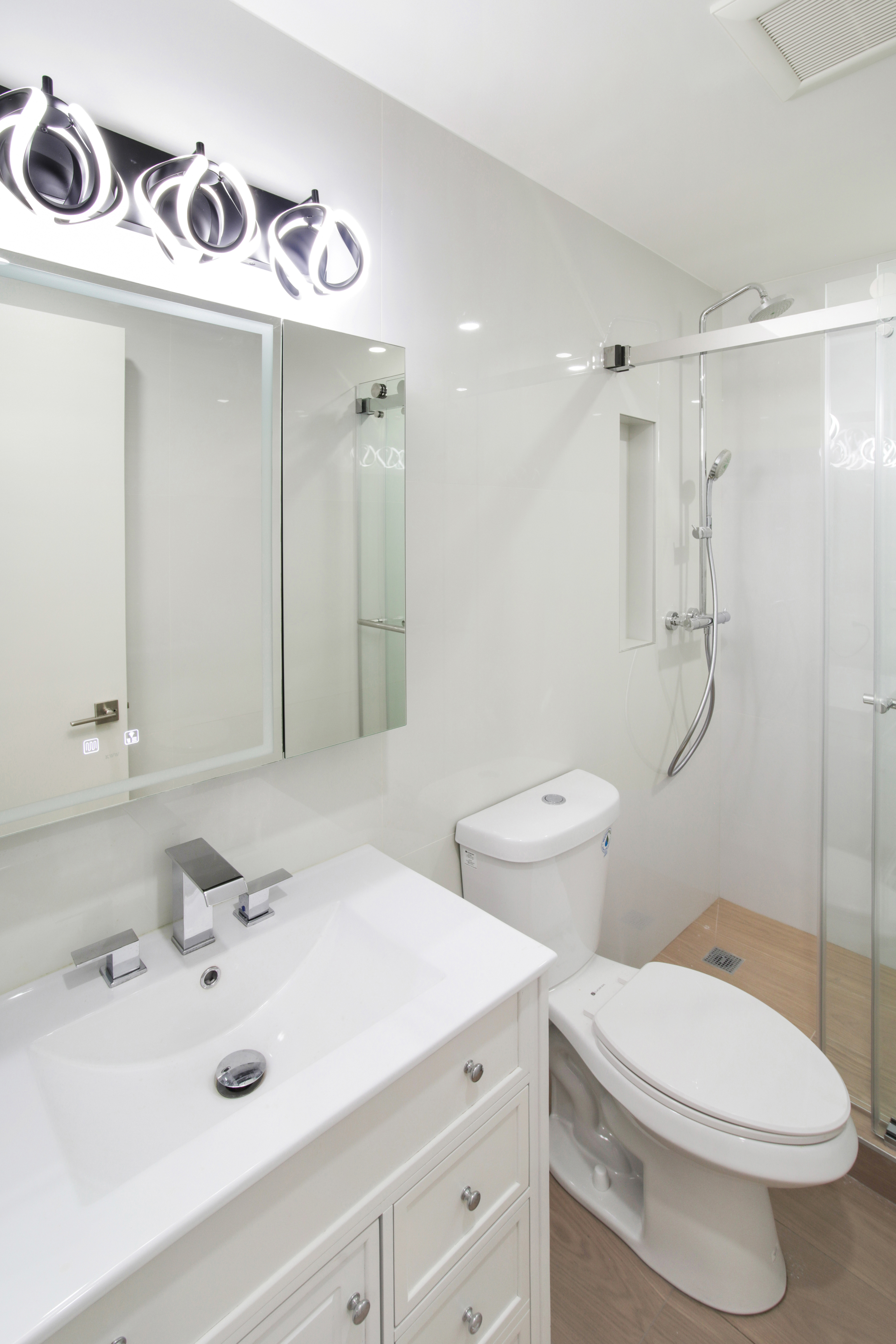 94 6th Avenue, Unit 3R Brooklyn, NY 11217 - Photo 8 of 12 a bathroom with a sink and mirror with toilet