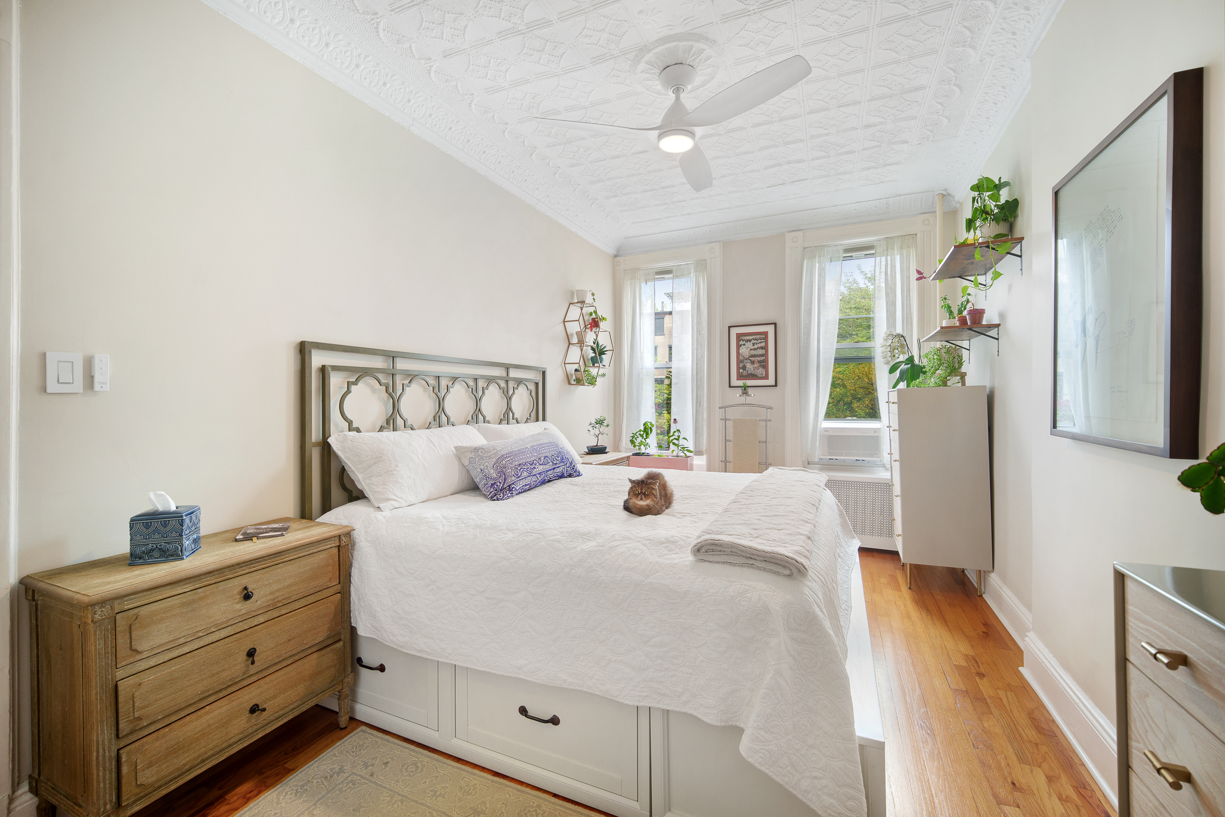 182 Saint Marks Avenue, Unit 2 Brooklyn, NY 11238 - Photo 7 of 14 a spacious bedroom with a bed and a flat screen tv