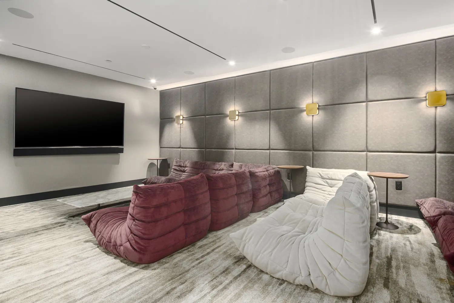 a living room with couches and a flat screen tv