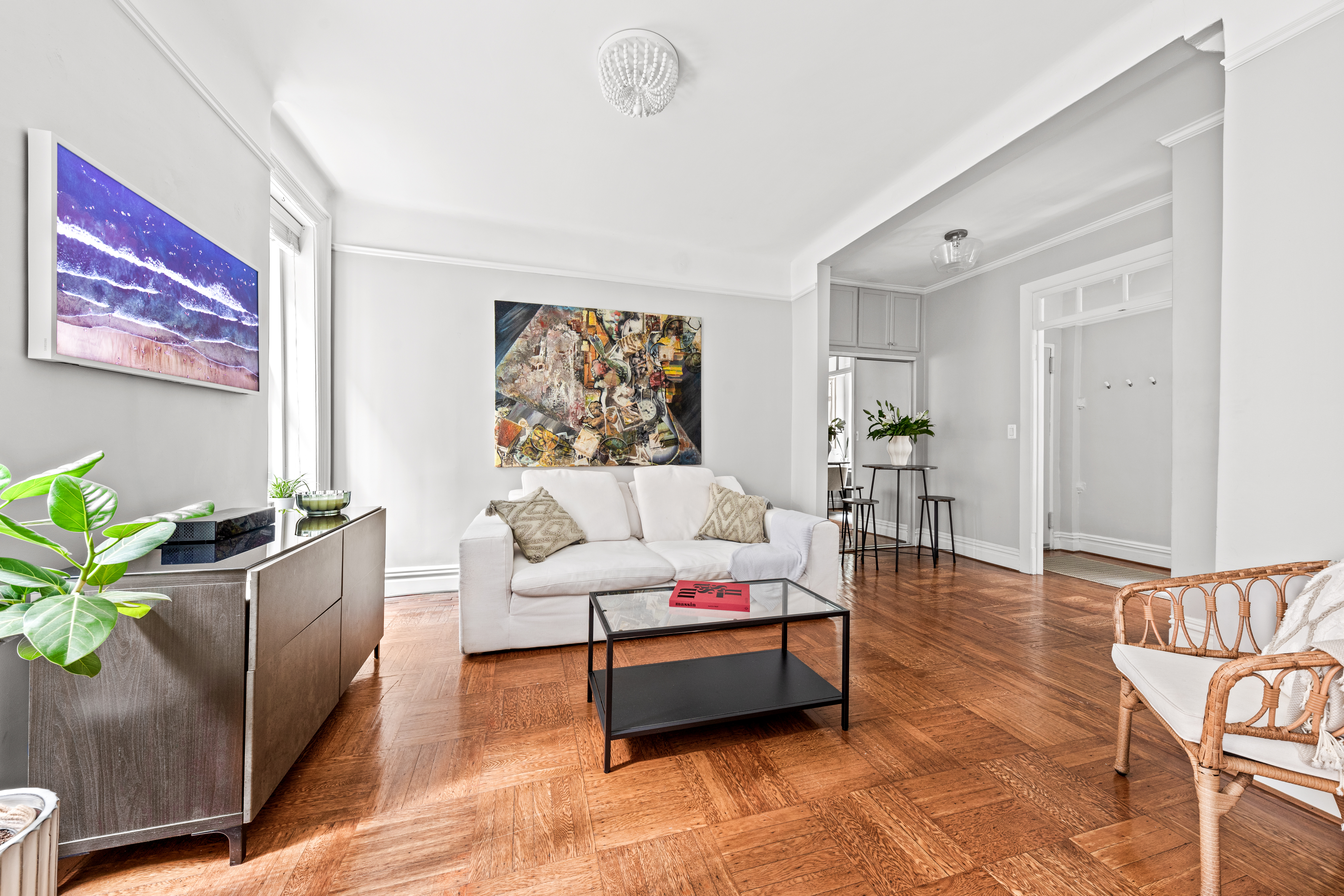 317 West 93rd Street, Unit 1C Manhattan, NY 10025 - Photo 3 of 9 a living room with furniture and a rug