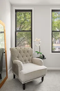 a living room with furniture and a window