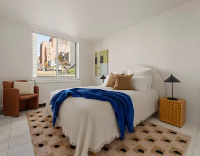 a living room with furniture and a mirror