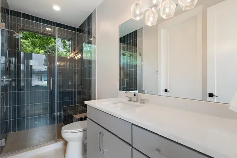 a en suite bathroom with a tub and view of bathroom