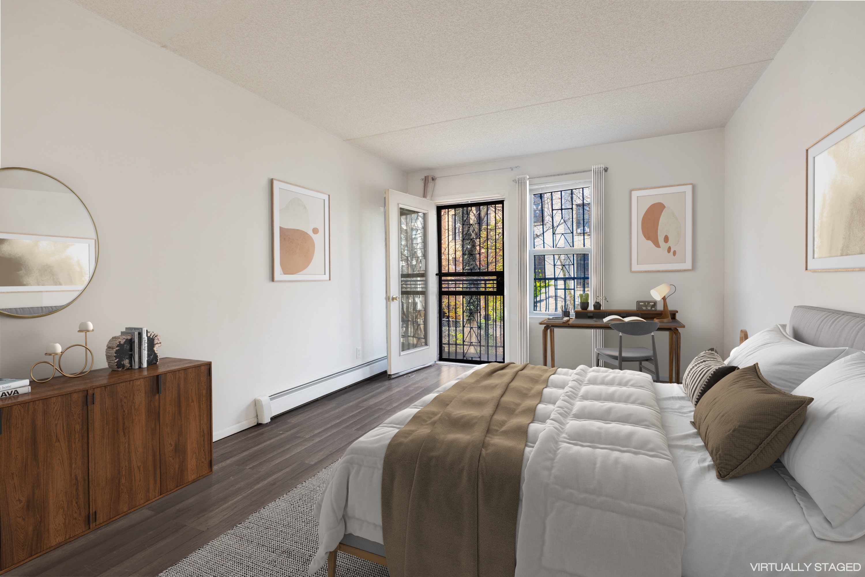 125 West 117th Street Manhattan, NY 10026 - Photo 5 of 23 a large bedroom with a bed and wooden floor