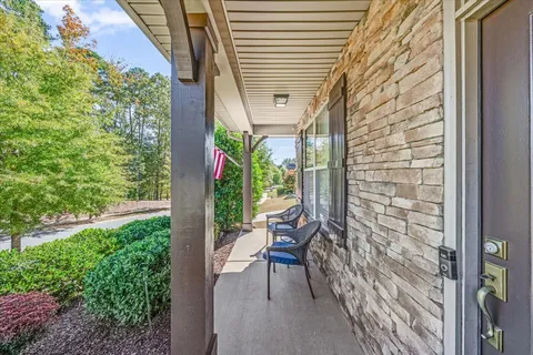 a view of a balcony with chairs and a table