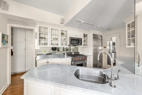 a living room with fireplace furniture and a flat screen tv