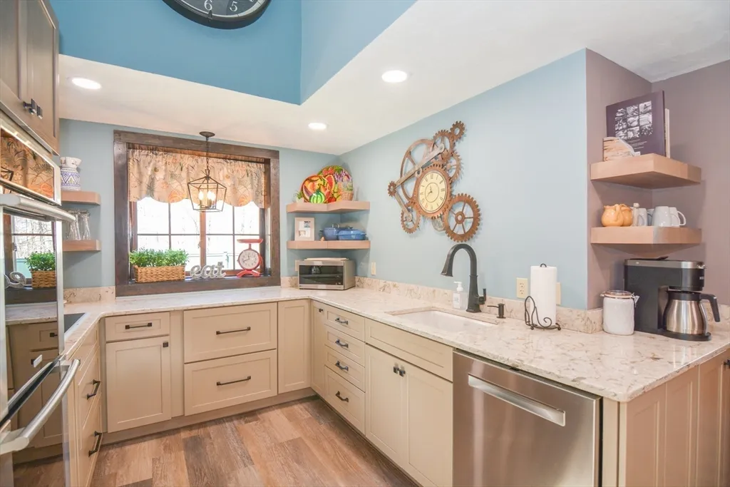 a spacious bathroom with a granite countertop sink and a large mirror