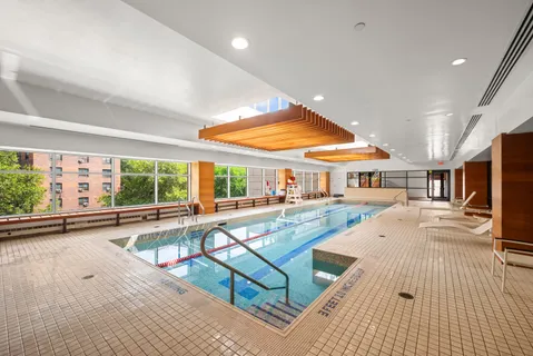 a living room with furniture stove and a table