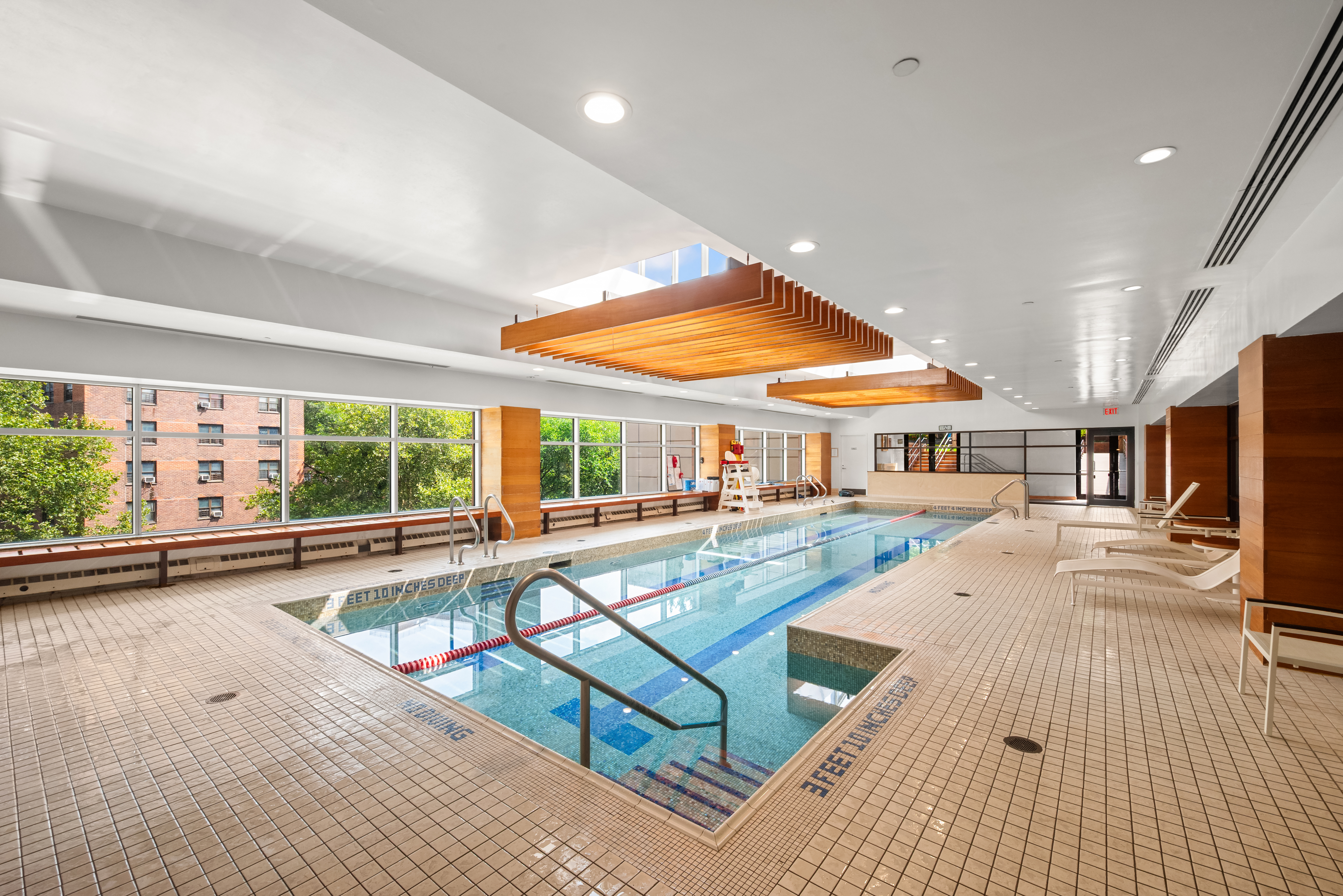 215-217 East 96th Street, Unit 25B Manhattan, NY 10128 - Photo 9 of 19 a living room with furniture stove and a table