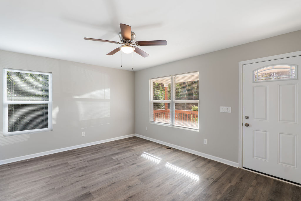 320 Adams Avenue Batesburg, SC 29006 - Photo 8 of 28 a view of empty room with wooden floor and fan