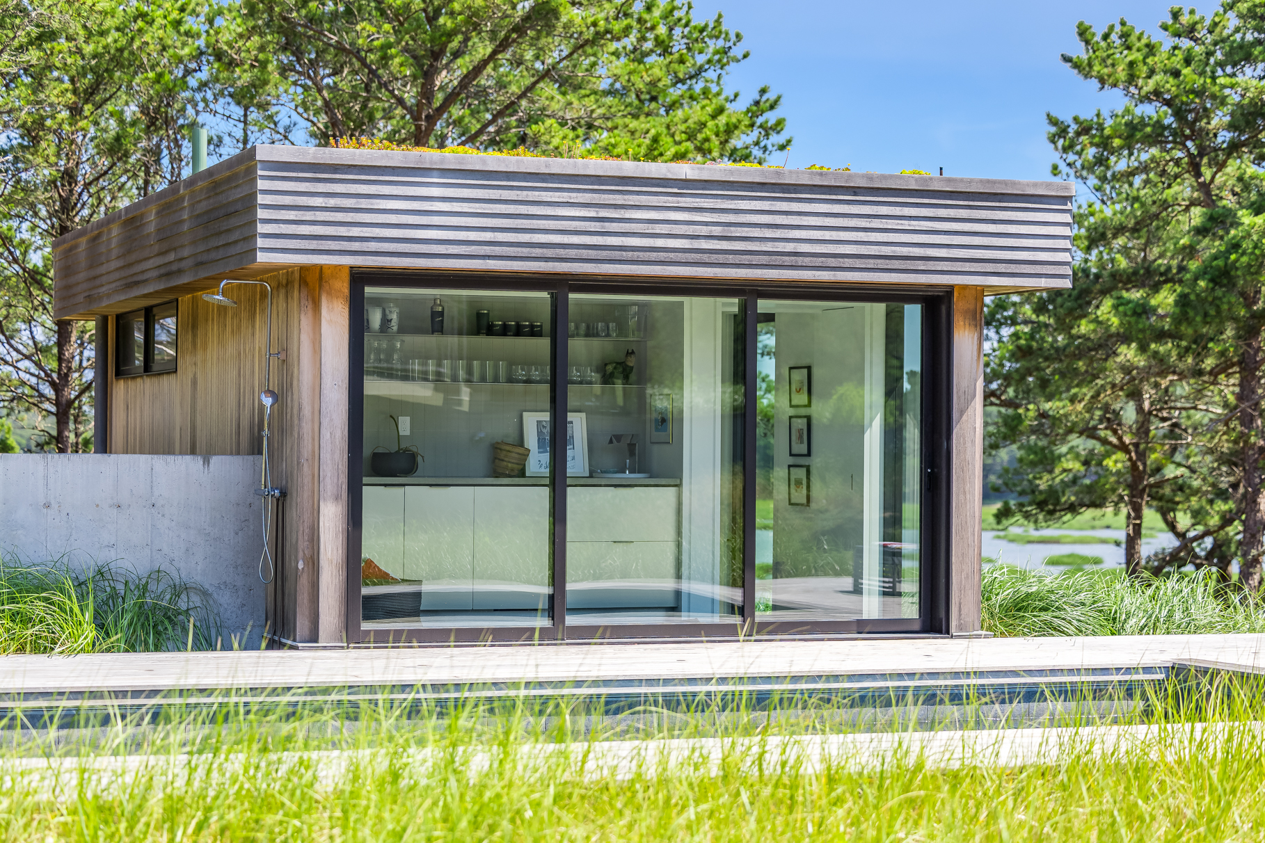 375 King Phillip Road Wellfleet, MA 02667 - Photo 23 of 27 a view of a house with a yard and sitting area