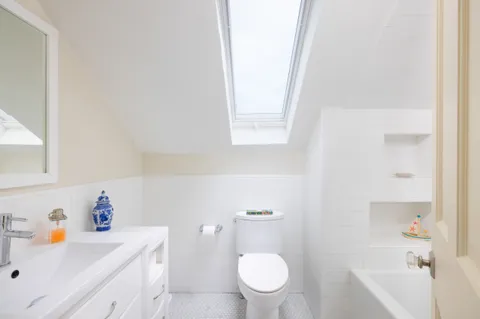 a bathroom with a sink a toilet and a bathtub