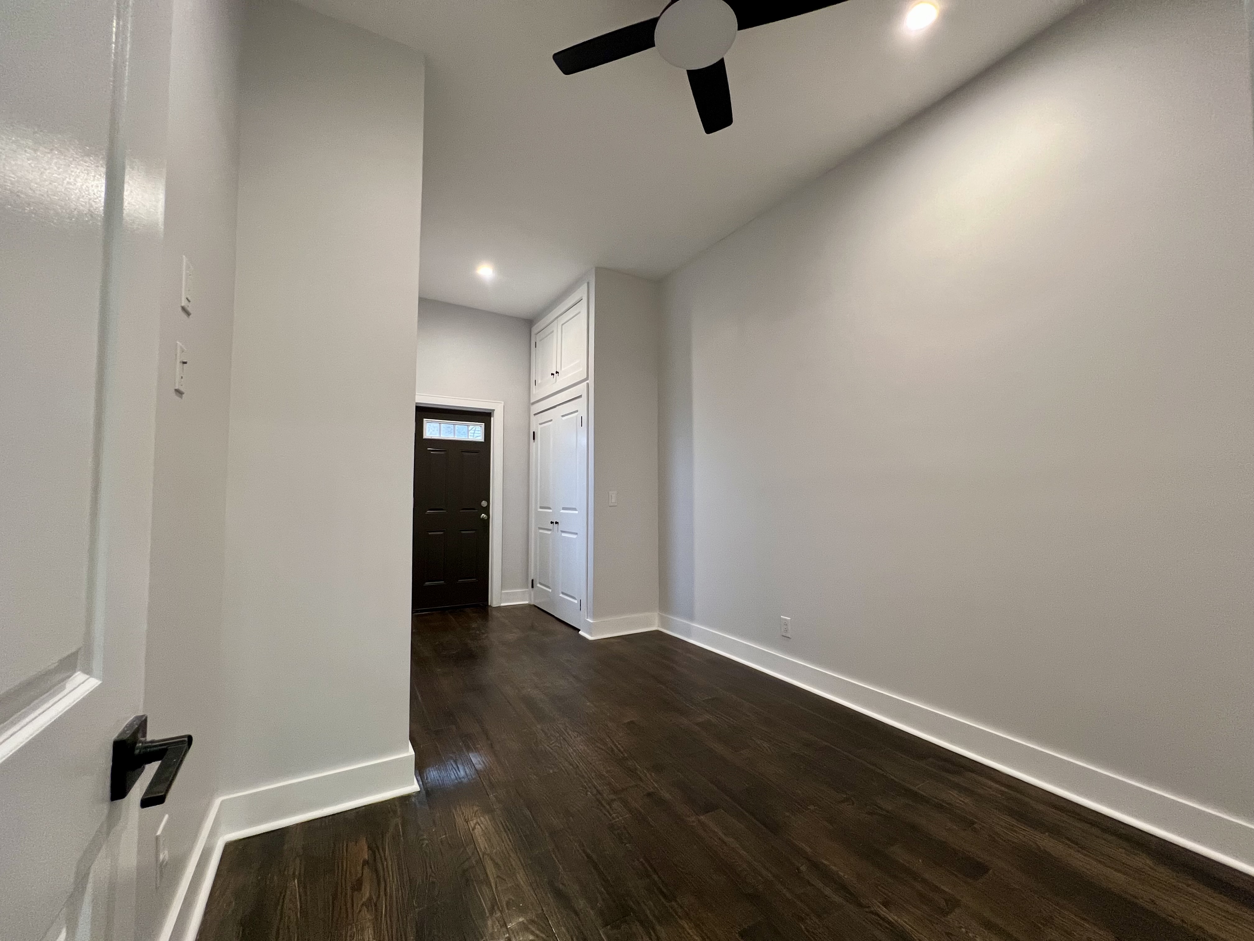 20 Suydam Street, Unit 1 Brooklyn, NY 11221 - Photo 8 of 10 an empty room with wooden floor and windows