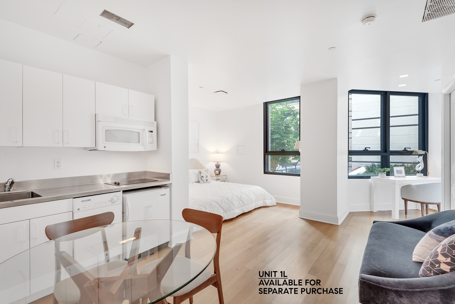 170 East End Avenue, Unit 16B Manhattan, NY 10128 - Photo 15 of 21 a living room with stainless steel appliances granite countertop furniture and a large window