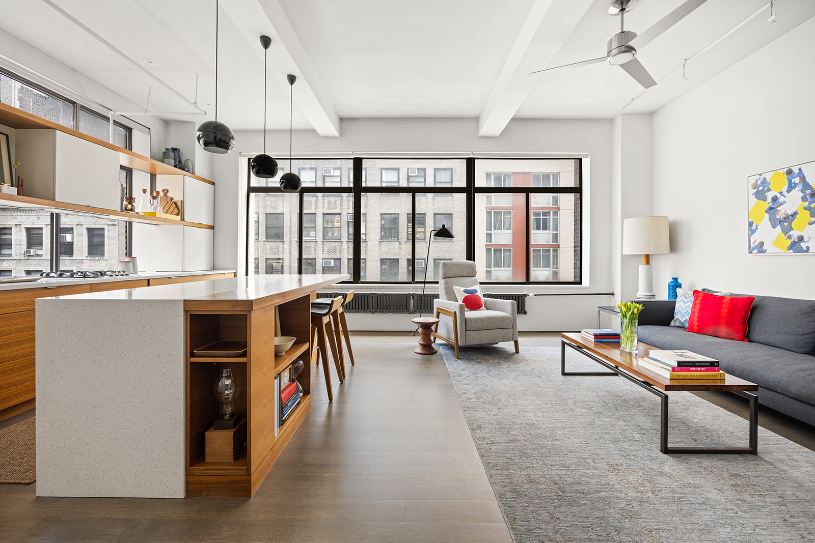 348 West 36th Street, Unit 6N Manhattan, NY 10018 - Photo 2 of 12 a living room with furniture and a floor to ceiling window