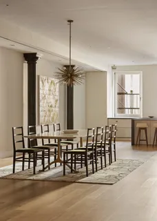a dining area with furniture and window