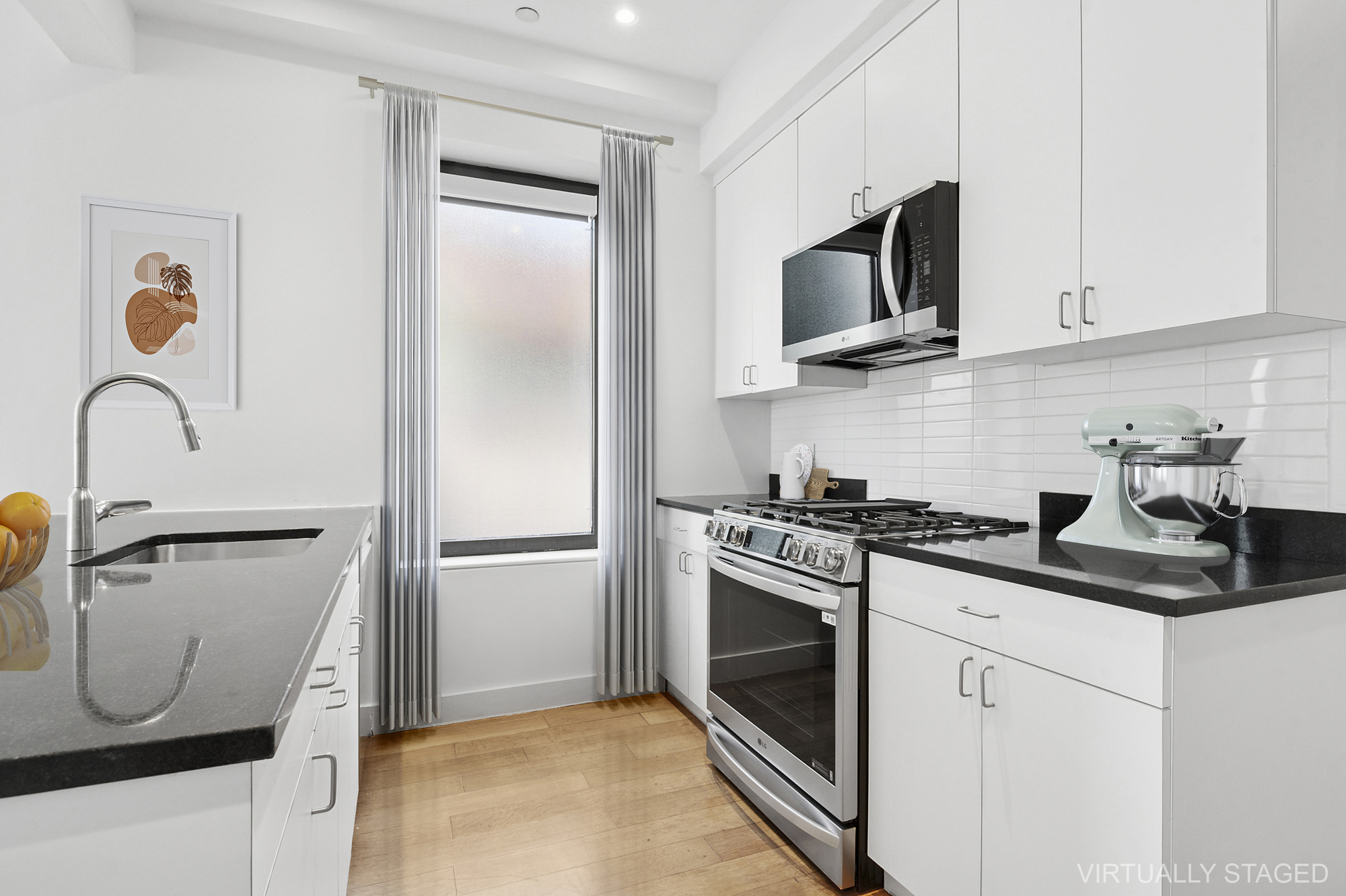 162 Beard Street, Unit 2 Brooklyn, NY 11231 - Photo 6 of 11 a kitchen with stainless steel appliances granite countertop a stove a microwave and a refrigerator