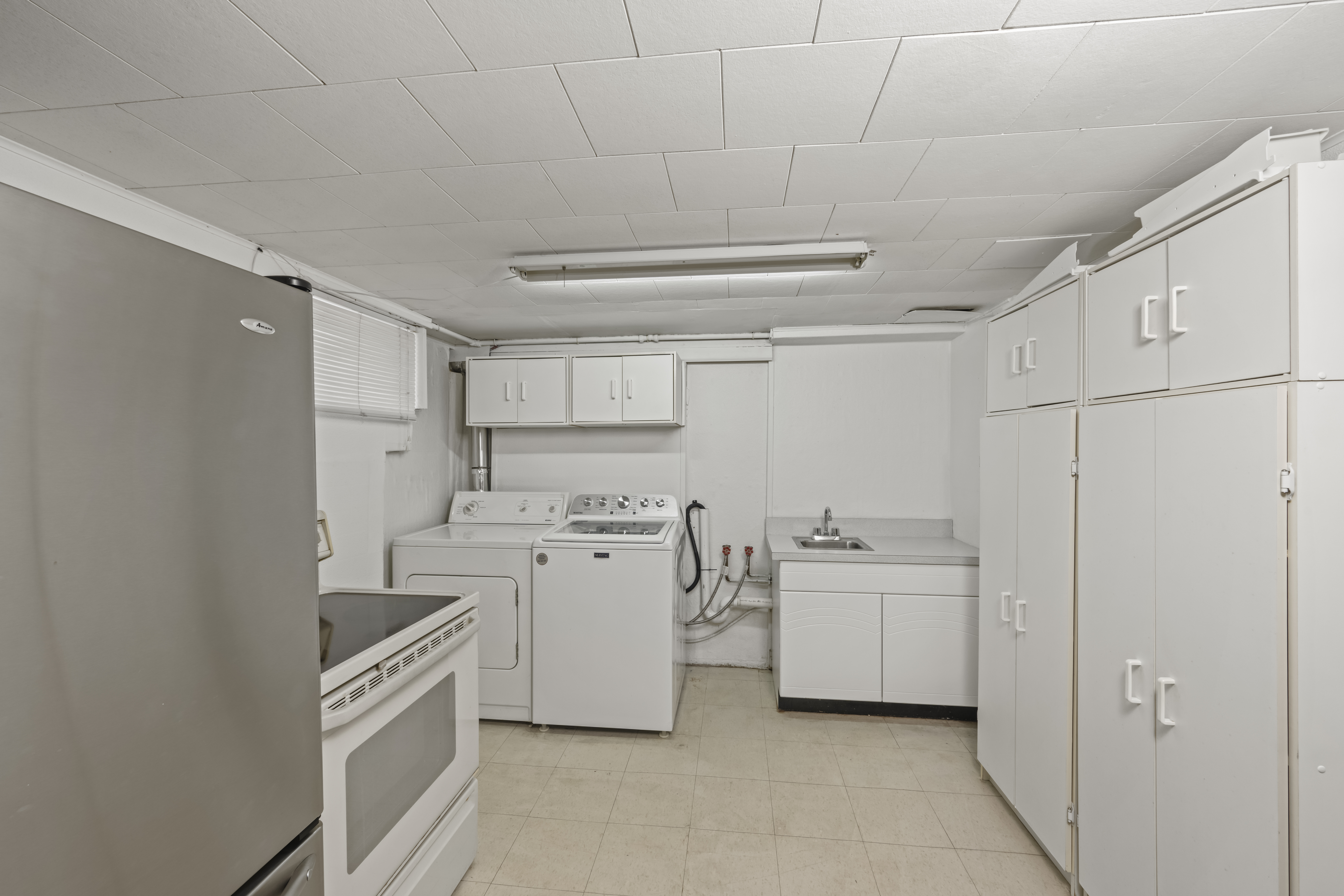 522 Stewart Avenue Staten Island, NY 10314 - Photo 21 of 33 a kitchen with white cabinets and white appliances