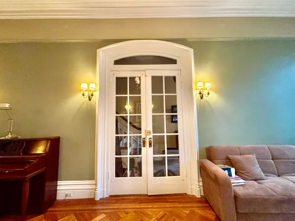 a living room with a couch and a stove top oven