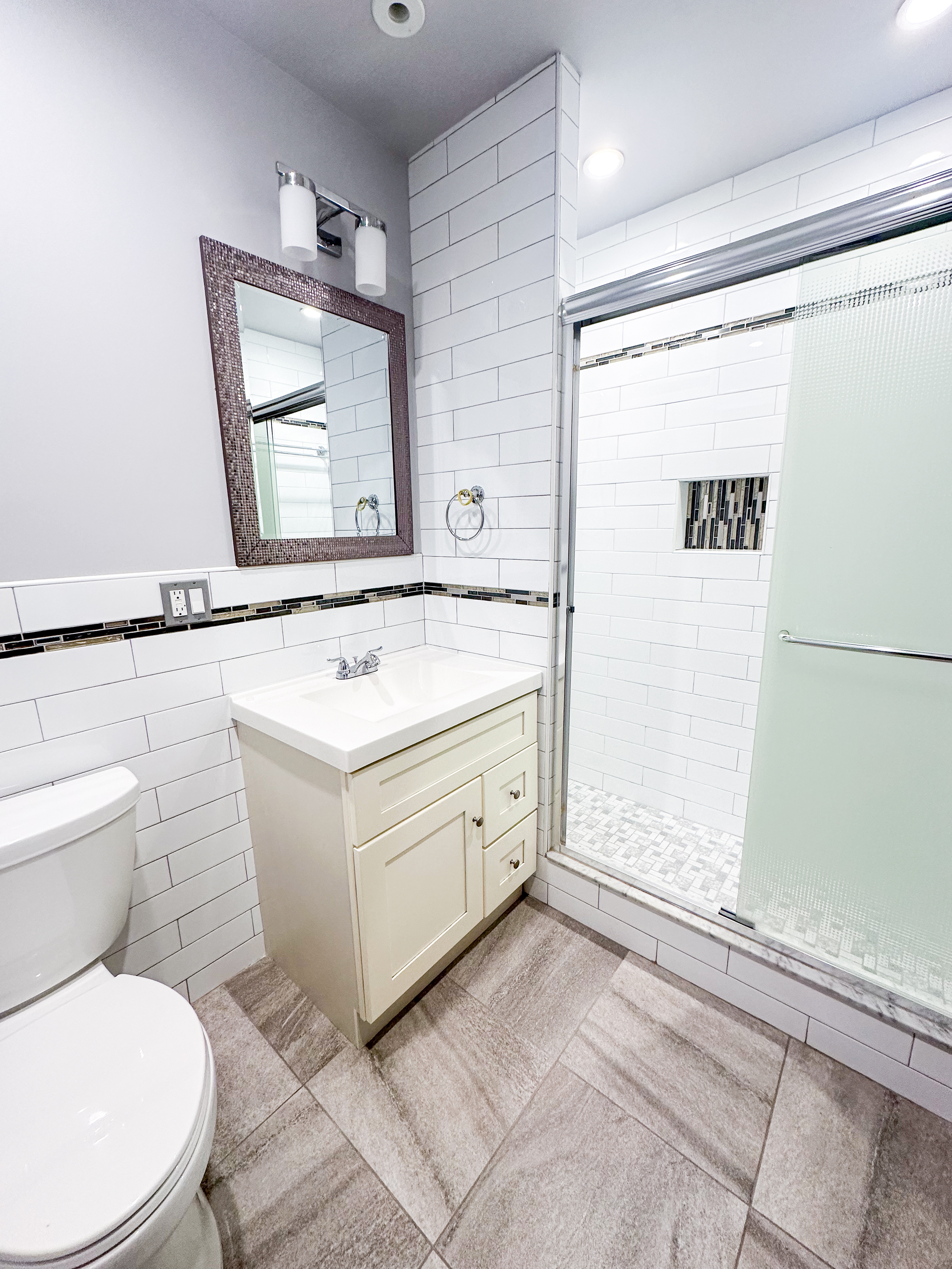 567 New Jersey Avenue, Unit 2 Brooklyn, NY 11207 - Photo 11 of 11 a bathroom with a sink toilet and shower