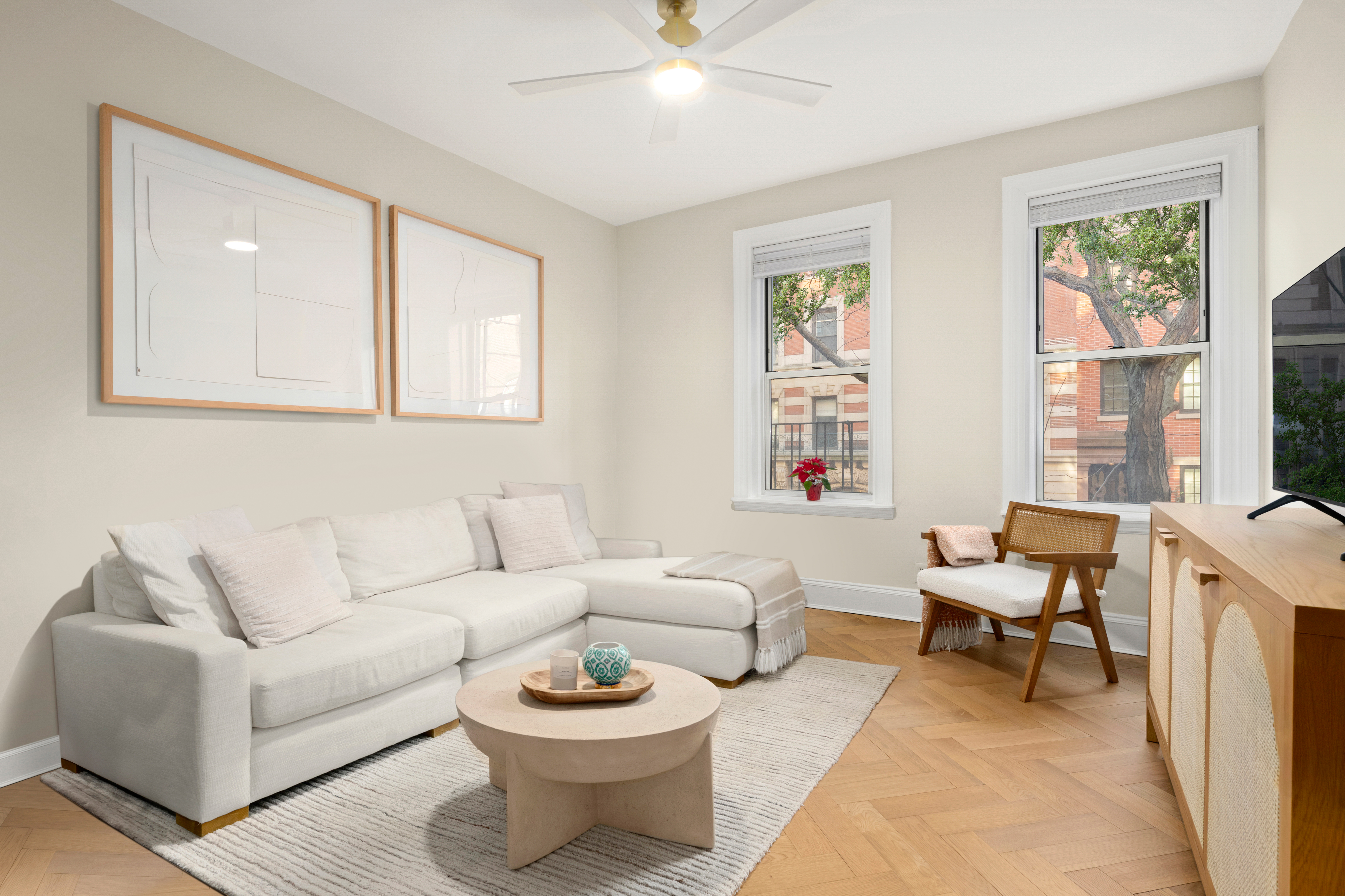 a living room with furniture a rug and a window