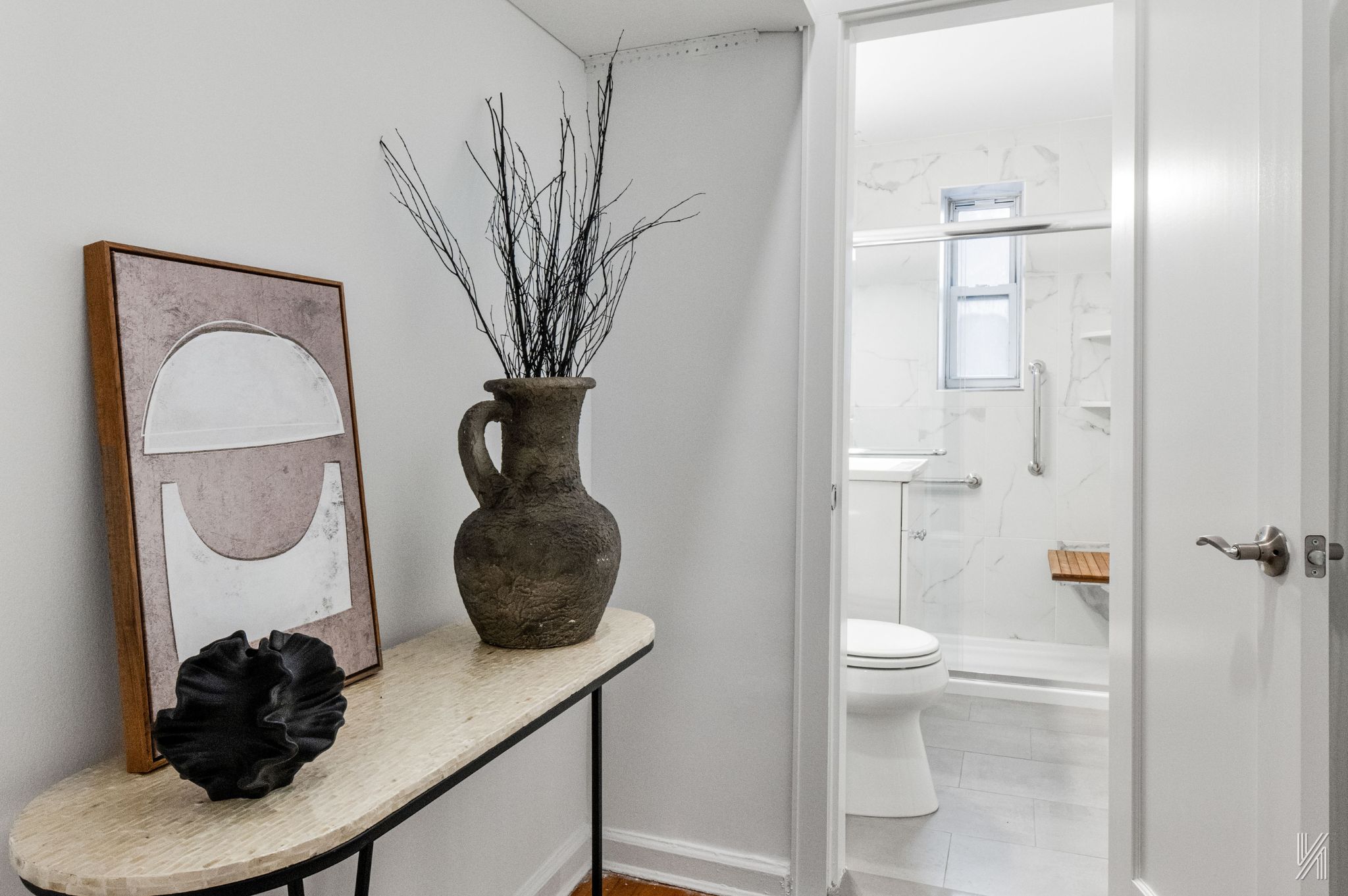 39-30 52nd Street, Unit GA Queens, NY 11377 - Photo 11 of 15 a bathroom with a toilet a sink and a mirror