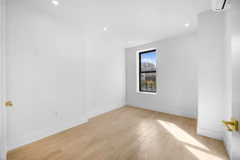 a view of an empty room and window