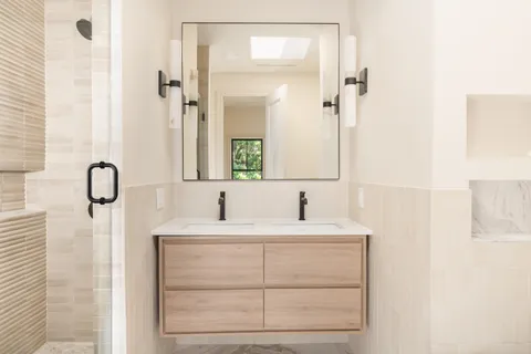 a bathroom with a sink and a mirror