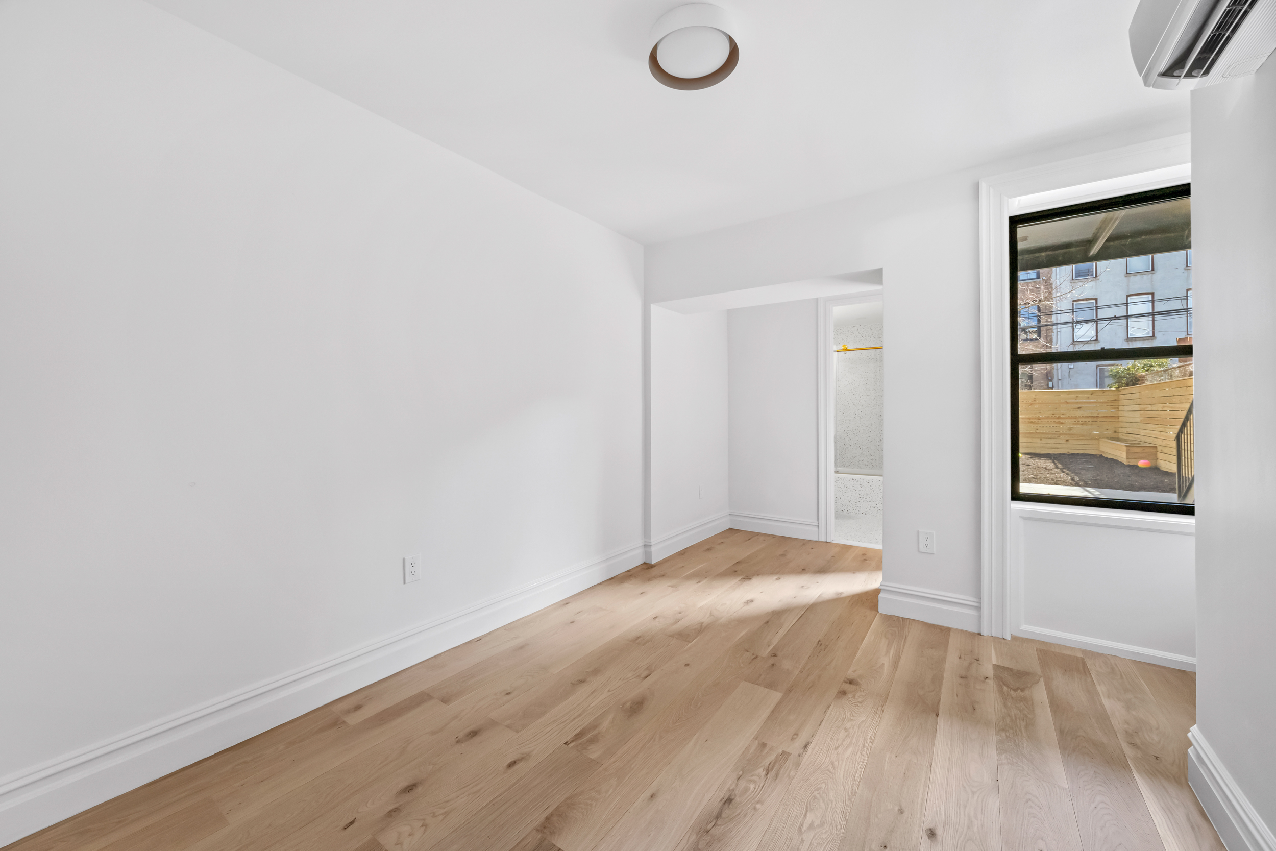 544 Madison Street, Unit A Brooklyn, NY 11221 - Photo 10 of 17 a view of an empty room and window