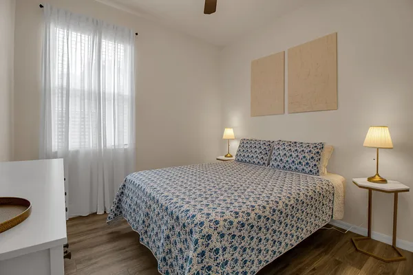 a view of a livingroom with furniture and a window