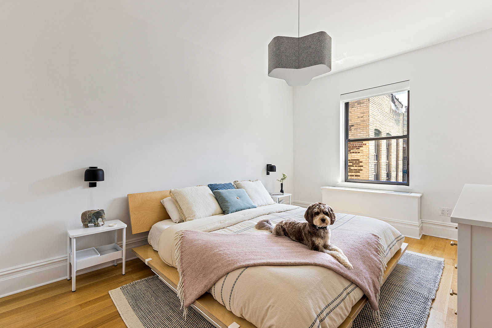 225 Eastern Parkway, Unit 6C Brooklyn, NY 11238 - Photo 4 of 12 a bedroom with a bed and a window