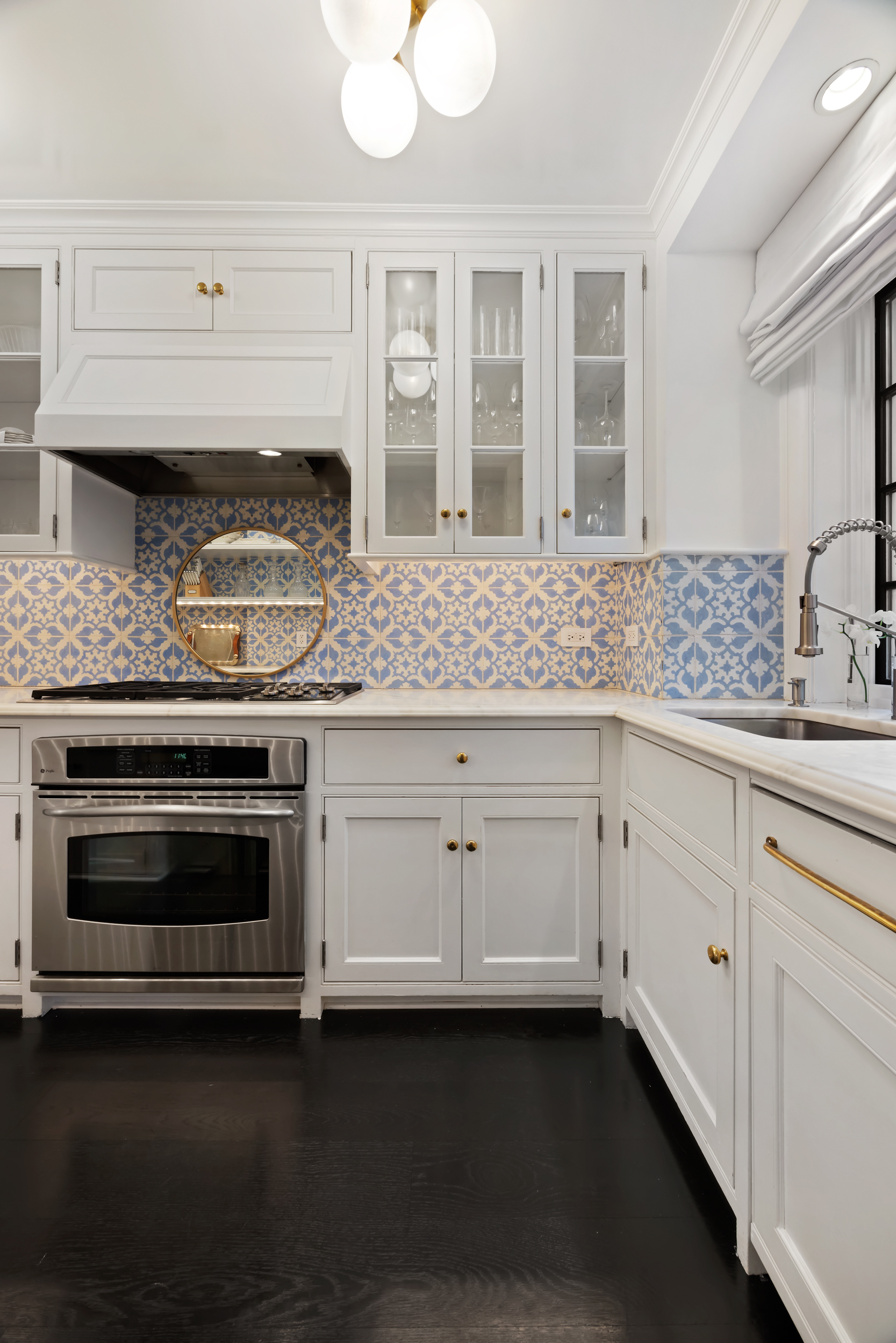 170 East 78th Street, Unit 8E Manhattan, NY 10075 - Photo 10 of 16 a kitchen with granite countertop white cabinets and white appliances