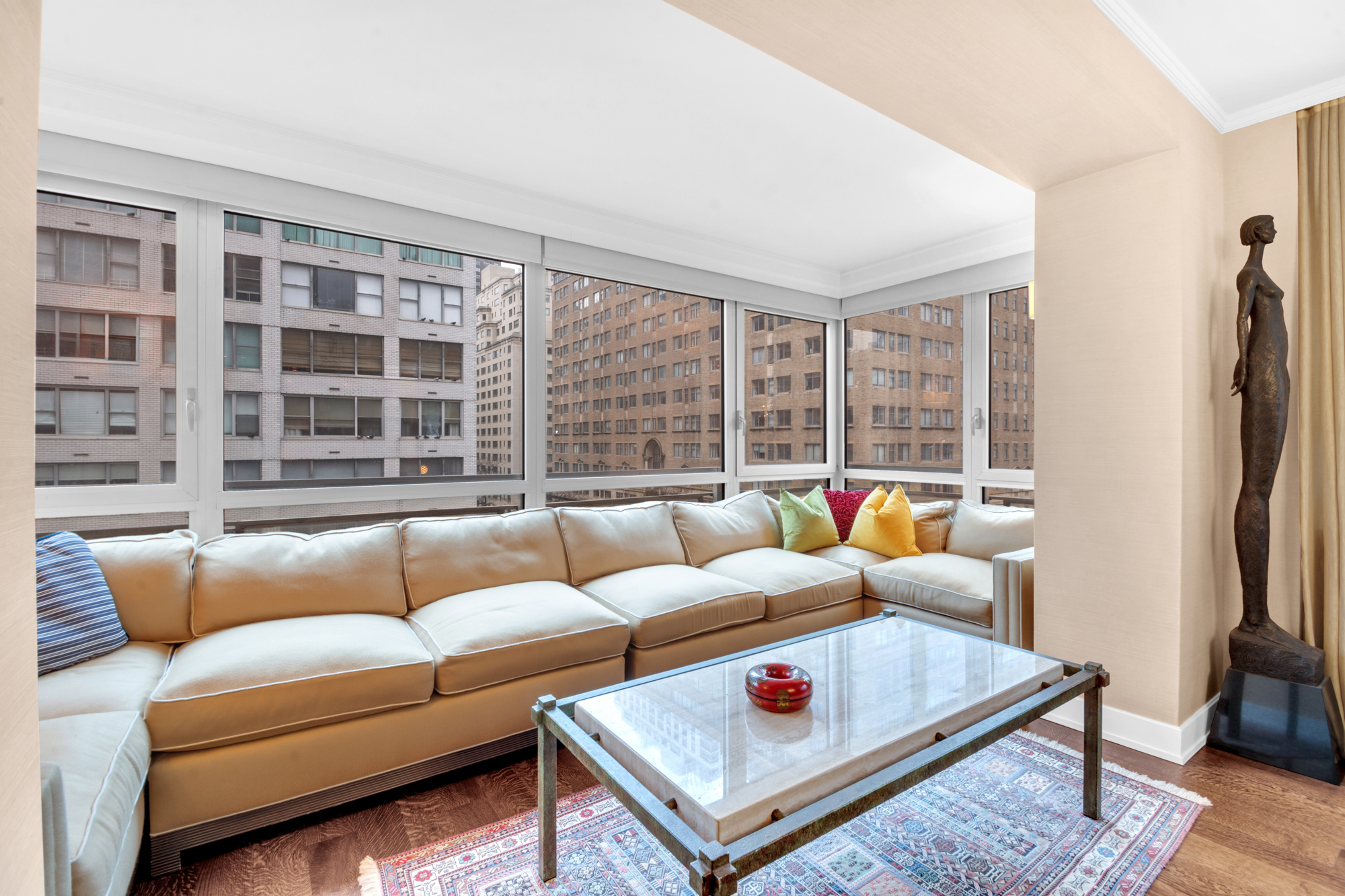 150 East 69th Street, Unit 6Q Manhattan, NY 10021 - Photo 10 of 15 a living room with furniture and a large window