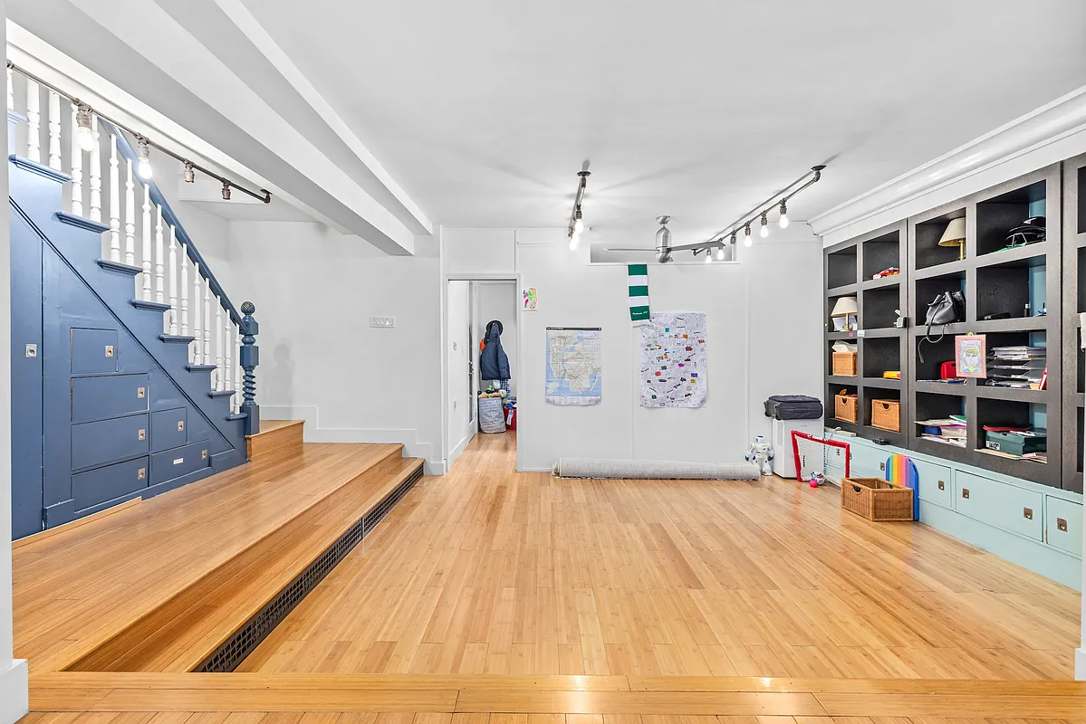 155 Luquer Street, Unit 1 Brooklyn, NY 11231 - Photo 7 of 13 a bedroom with a bed and a book shelf