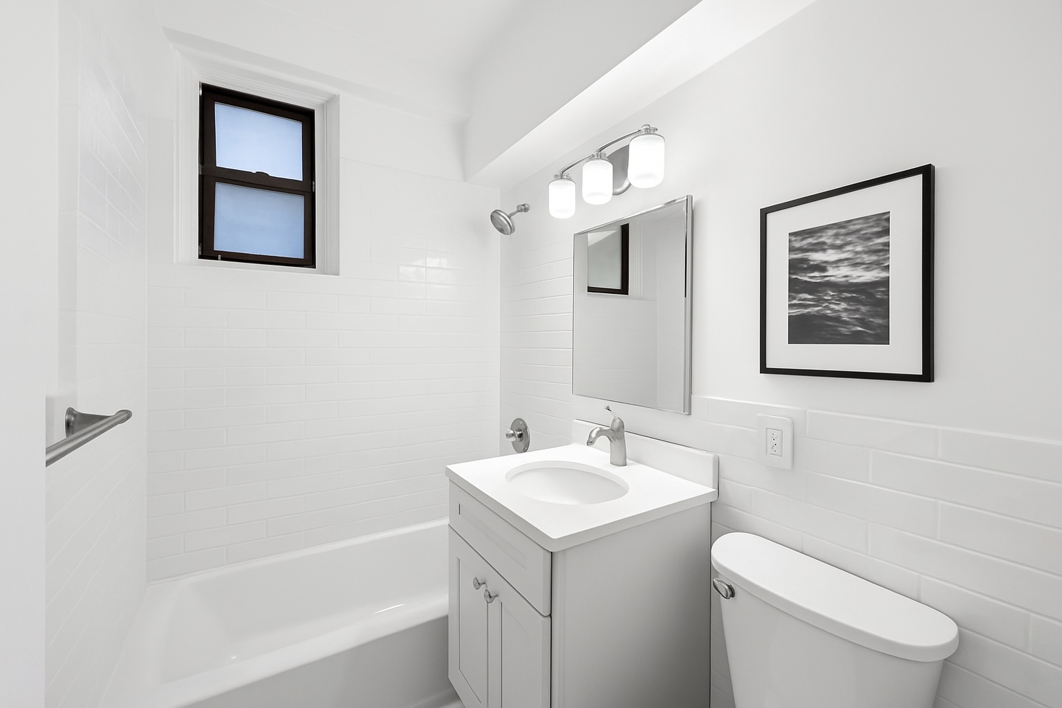 330 3rd Avenue, Unit 1J Manhattan, NY 10010 - Photo 6 of 9 a bathroom with a toilet sink and mirror