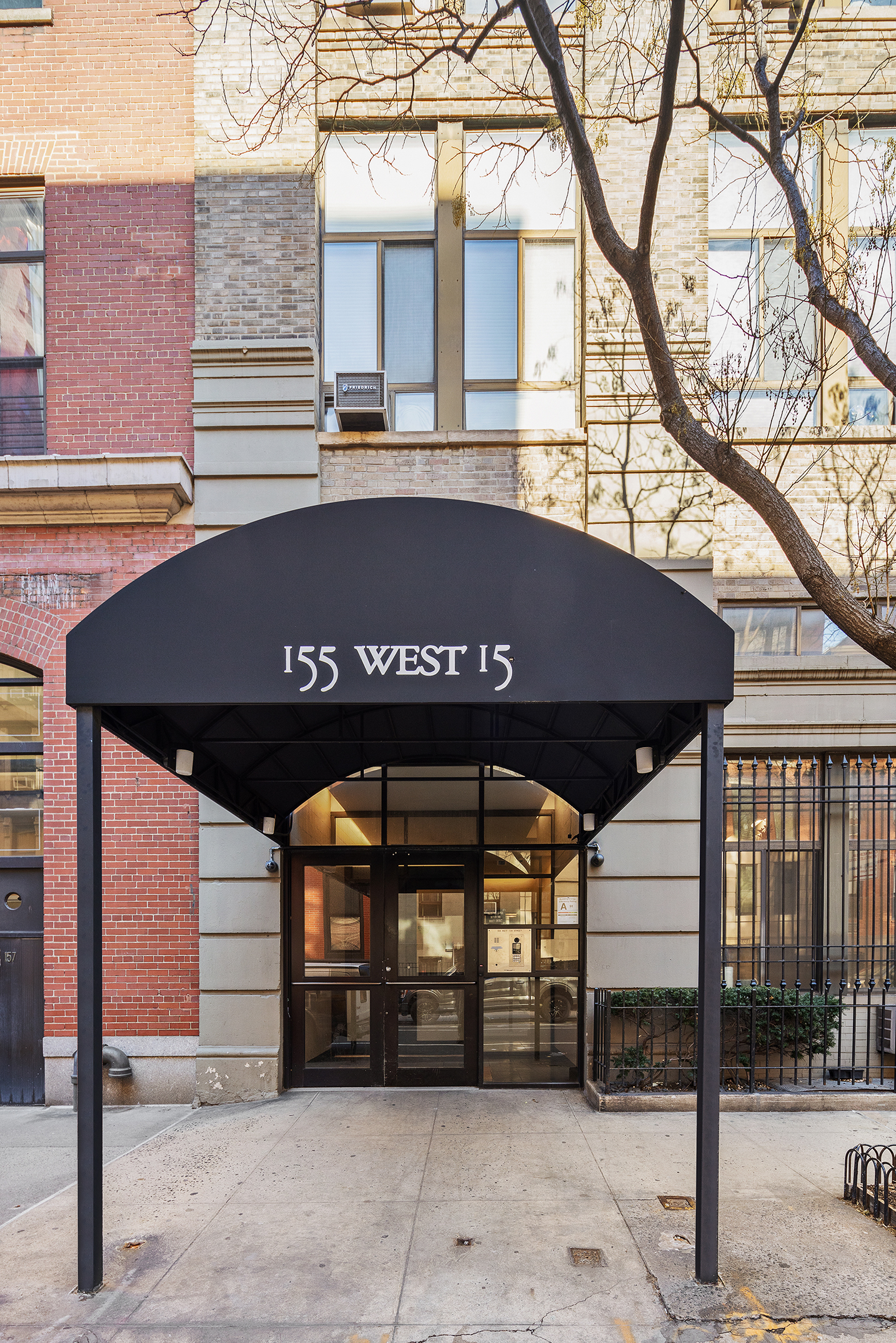 155 West 15th Street, Unit 1J Manhattan, NY 10011 - Photo 11 of 13 a front view of a building with grey walls